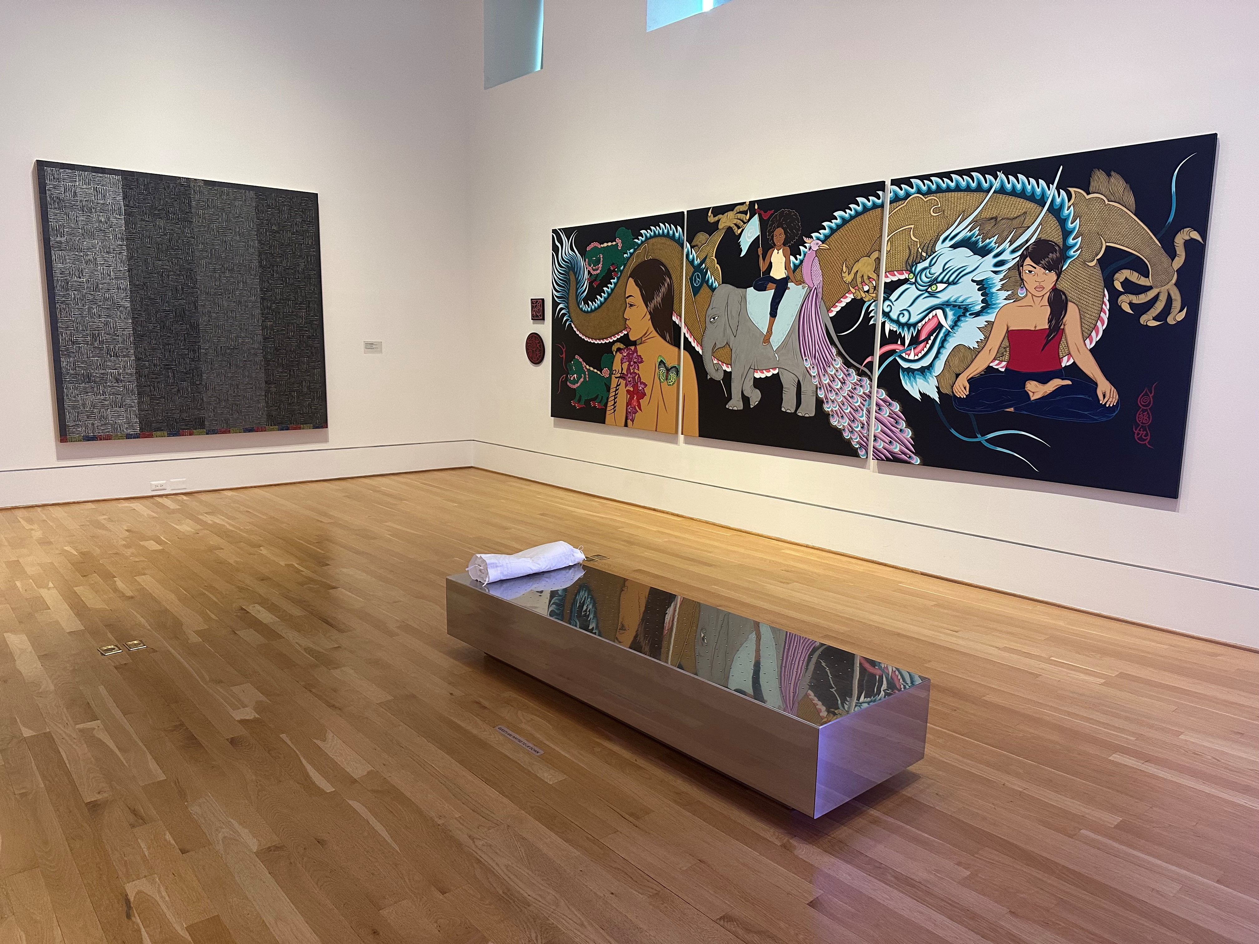 Installation view of artworks by Binion and Beynon on the wall, Soares in the middle of the gallery