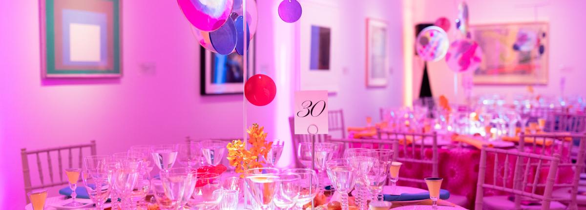Multicolored tablescape featuring silk hoops made by Creative Aging participants, inspired by Linling Lu’s Soundwaves.