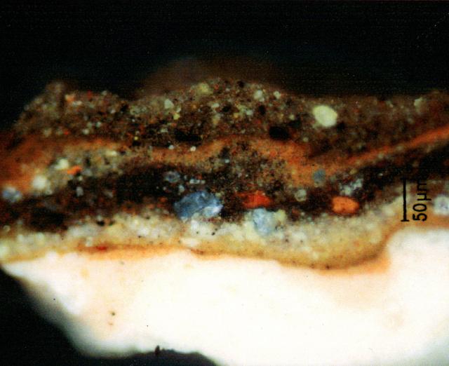 The painting's strongly textured and deeply cracked surface reflects Daumier's practice of painting one layer on top of the next without allowing for the underlying paint applications to fully dry. A microscopic paint cross-section taken from the upper left reveals no less than eight distinct layers in this heavily-reworked picture. The bottom layer is the white ground (1), followed by a thin red (2), a white (3), a dark brown (4), a thin light brown (5), a thicker red (6), another dark brown (7